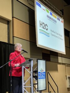 Carol Johnson speaking to the Tri-City Regional Chamber of Commerce